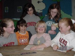 Hannah Samuelson surrounded by her classmatesr