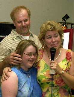 Kelly Sweeney and her parents